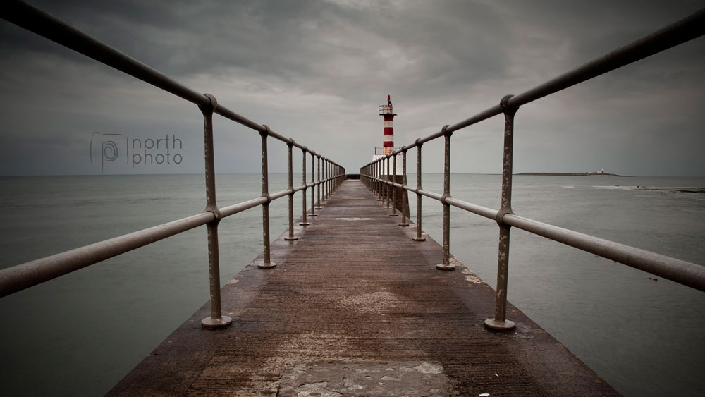 Amble's South Pier, with Coquet Island in the background