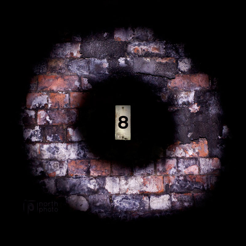 Lightpainting around a marker in an abandoned railway tunnel